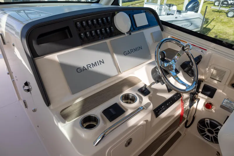 Slide: The Image of 2024 Grady-White Freedom 375 helm with Garmin navigation and modern controls. - 17