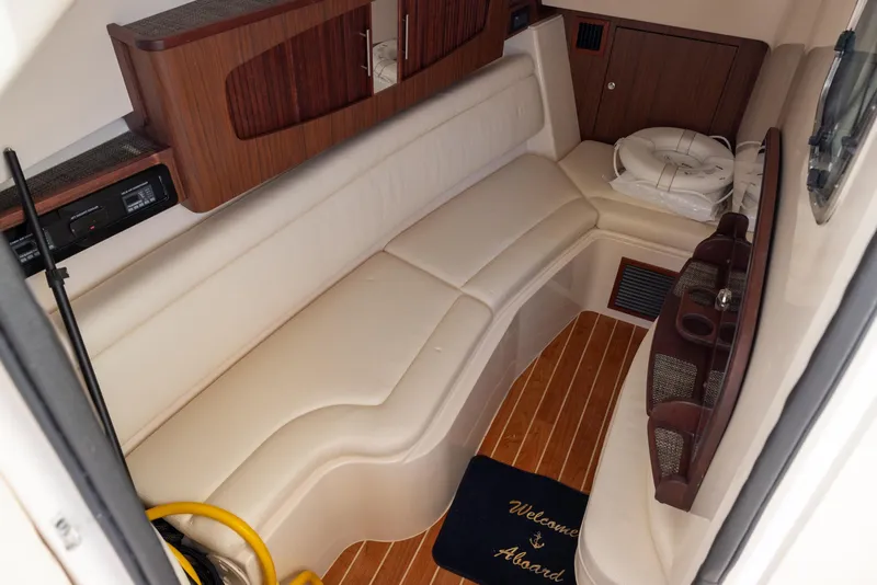 Slide: The Image of 2024 Grady-White Freedom 375 cabin with beige seating and wood accents. - 20