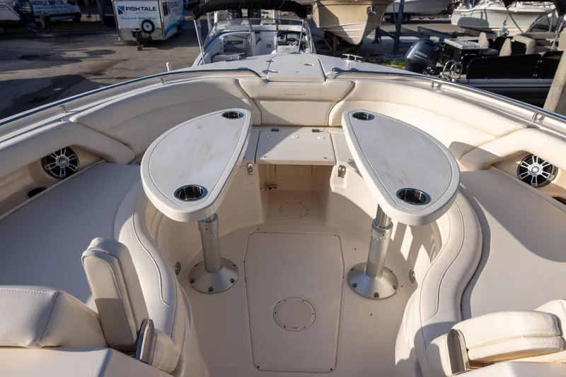 Slide: The Image of 2024 Grady-White Freedom 375 boat interior with dual tables and seating. - 24