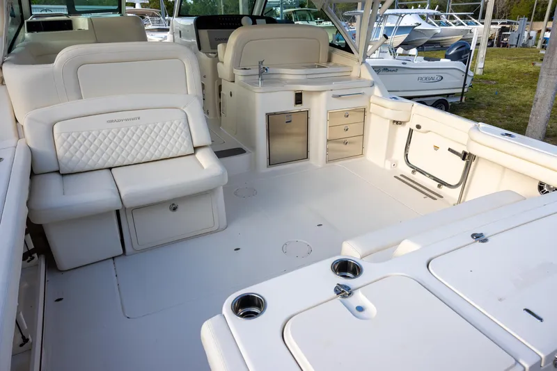 Slide: The Image of 2024 Grady-White Freedom 375 boat interior with seating and storage compartments. - 5