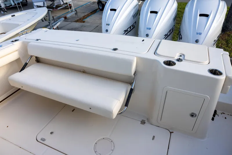 Slide: The Image of 2024 Grady-White Freedom 375 boat with foldable seating and Yamaha outboard engines. - 6