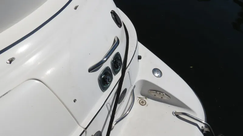 Slide: The Image of 1998 Doral 300 SC V Drive boat deck with cleats and rope. - 19