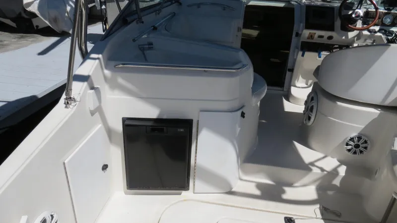 Slide: The Image of 1998 Doral 300 SC V Drive boat interior with seating and control panel. - 20