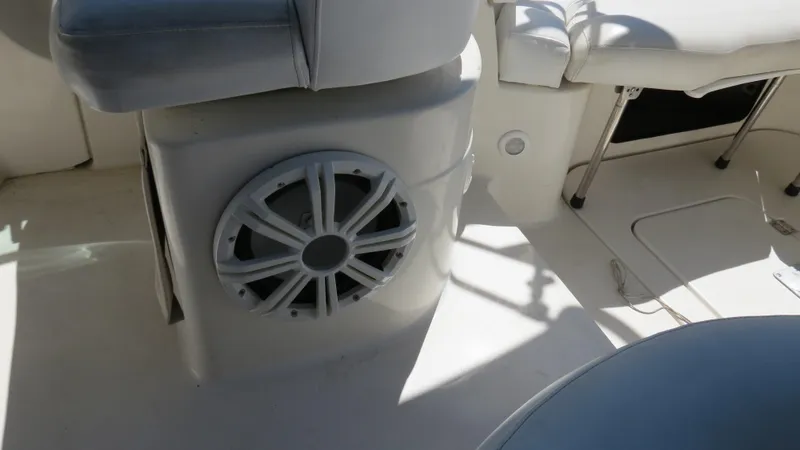 Slide: The Image of Interior of 1998 Doral 300 SC V Drive boat with speaker and seating. - 25