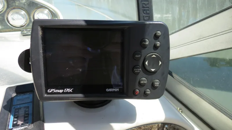 Slide: The Image of Garmin GPSmap 176C on 1998 Doral 300 SC V Drive boat dashboard. - 34