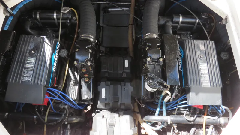 Slide: The Image of 1998 Doral 300 SC V Drive engine compartment with dual MerCruiser engines. - 39
