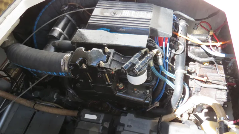 Slide: The Image of Engine of a 1998 Doral 300 SC V Drive boat, showcasing intricate components and wiring. - 40