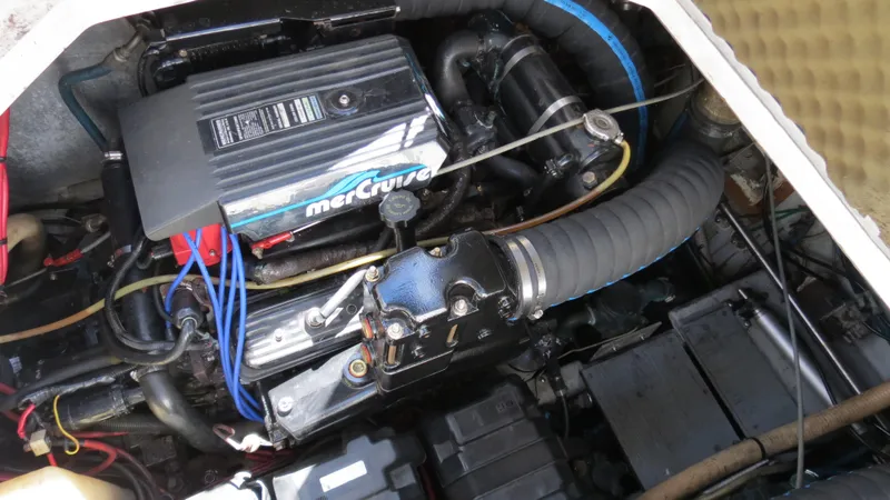 Slide: The Image of Engine compartment of a 1998 Doral 300 SC V Drive boat with MerCruiser components. - 41