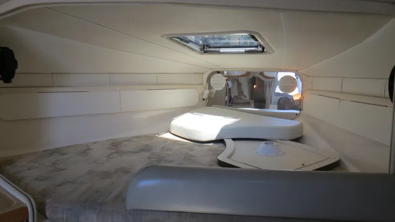 Slide: The Image of 1998 Doral 300 SC V Drive cabin interior with skylight and seating area. - 48