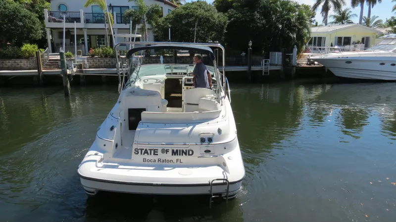 Slide: The Image of 1998 Doral 300 SC V Drive boat docked in Boca Raton, Florida canal. - 9
