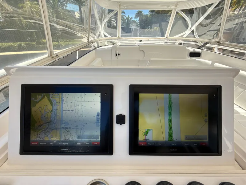 Slide: The Image of 2013 Intrepid 390 Sport Yacht cockpit with dual navigation screens. - 10