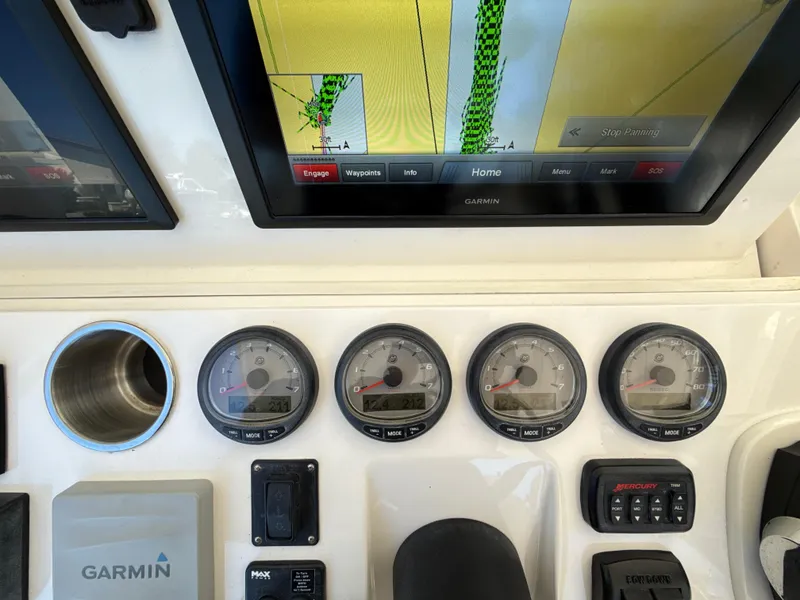 Slide: The Image of Control panel of a 2013 Intrepid 390 Sport Yacht with Garmin navigation system. - 12