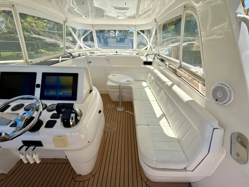 Slide: The Image of 2013 Intrepid 390 Sport Yacht interior with helm, seating, and navigation screens. - 15