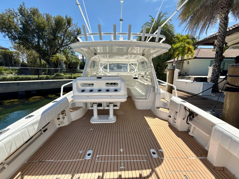 Slide: The Image of 2013 Intrepid 390 Sport Yacht with spacious deck and modern design. - 8