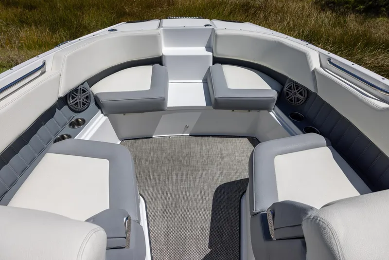 Slide: The Image of 2019 Cobalt 25SC boat interior with gray and white seating, spacious layout, and modern design. - 14