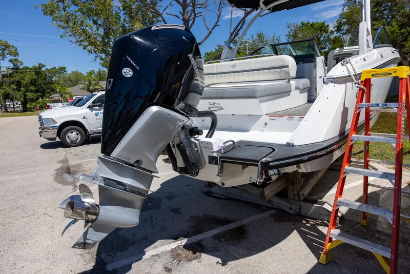 Slide: The Image of 2019 Cobalt 25SC boat with outboard motor in a parking lot. - 5