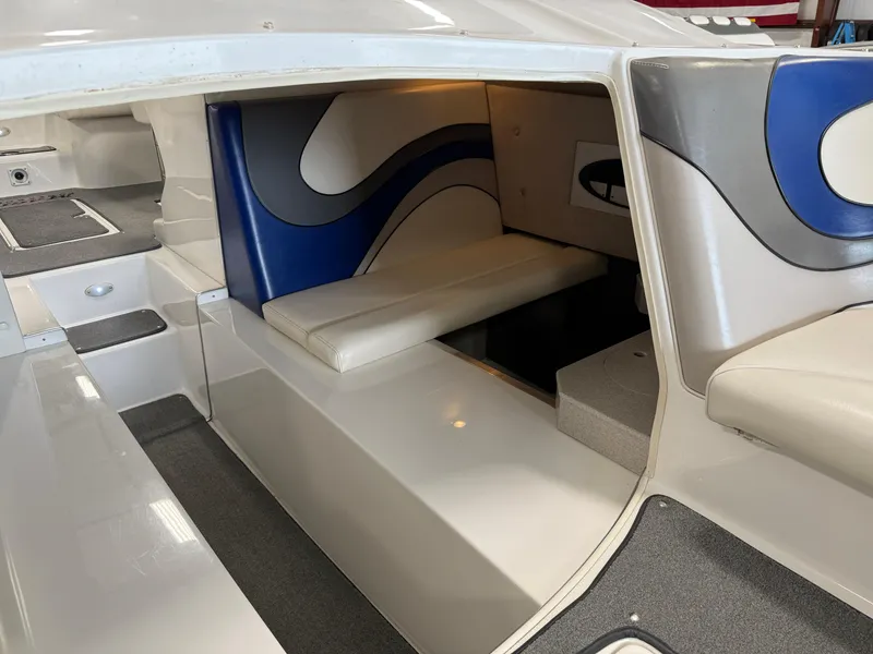 Slide: The Image of Interior of a 2008 Magic 30' Sceptor boat with modern seating and sleek design. - 24