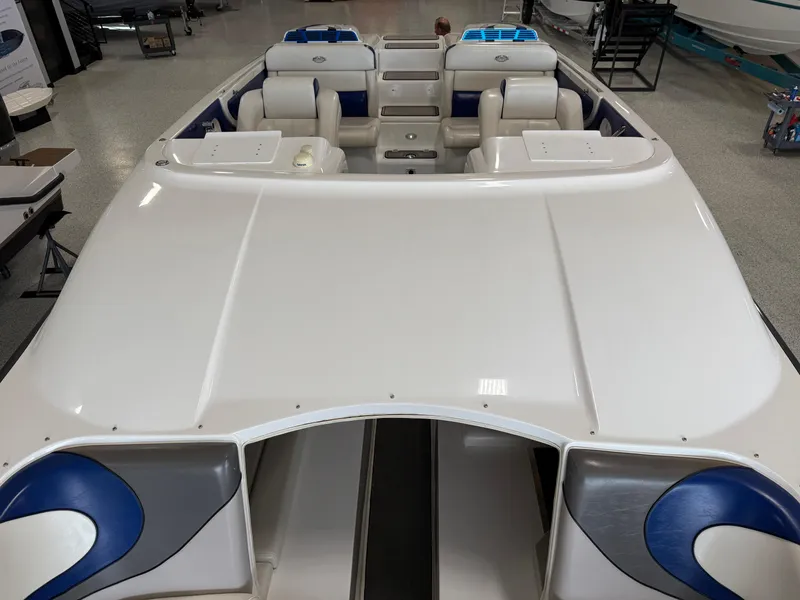 Slide: The Image of 2008 Magic 30' Sceptor boat with sleek white and blue interior design. - 25