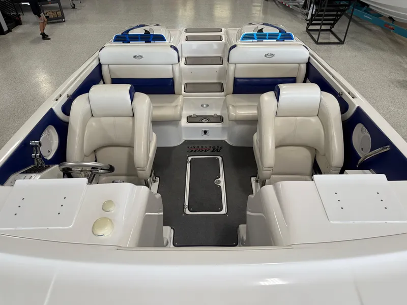 Slide: The Image of 2008 Magic 30' Sceptor boat interior with white and blue seating. - 26