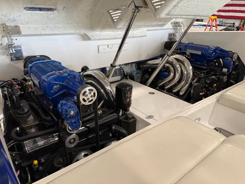 Slide: The Image of 2008 Magic 30' Sceptor boat engine compartment with dual high-performance engines. - 35