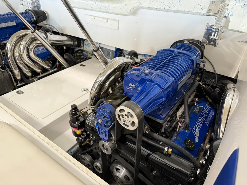 Slide: The Image of Engine compartment of a 2008 Magic 30' Sceptor boat with Mercury engines. - 37