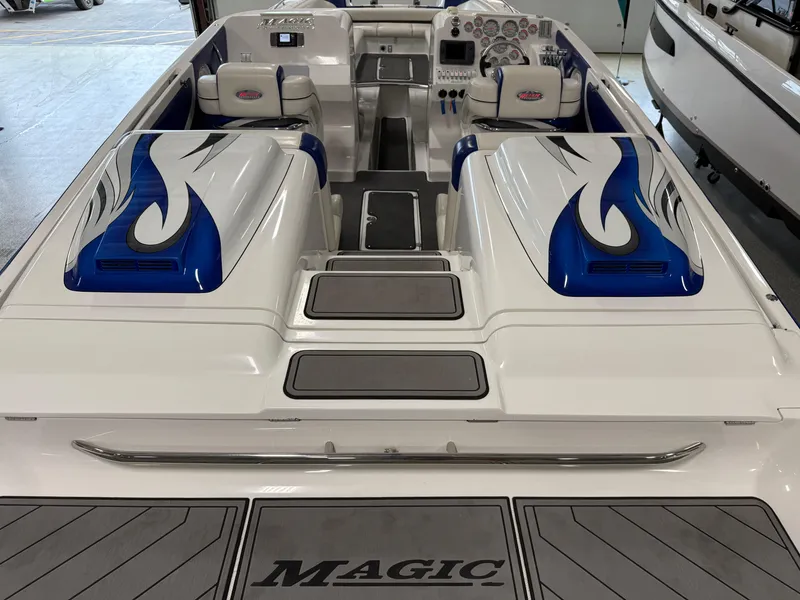 Slide: The Image of 2008 Magic 30' Sceptor boat interior with blue flame design and seating. - 40