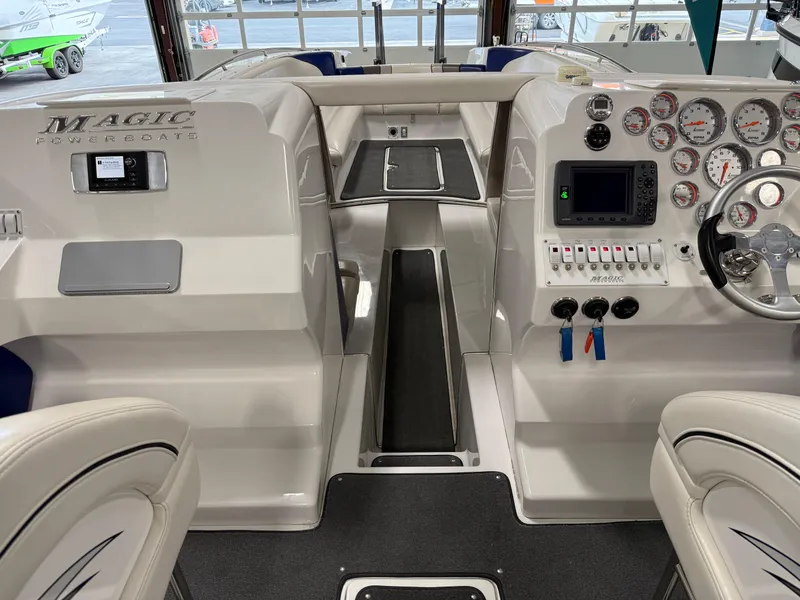 Slide: The Image of 2008 Magic 30' Sceptor boat interior with dashboard and seating area. - 43