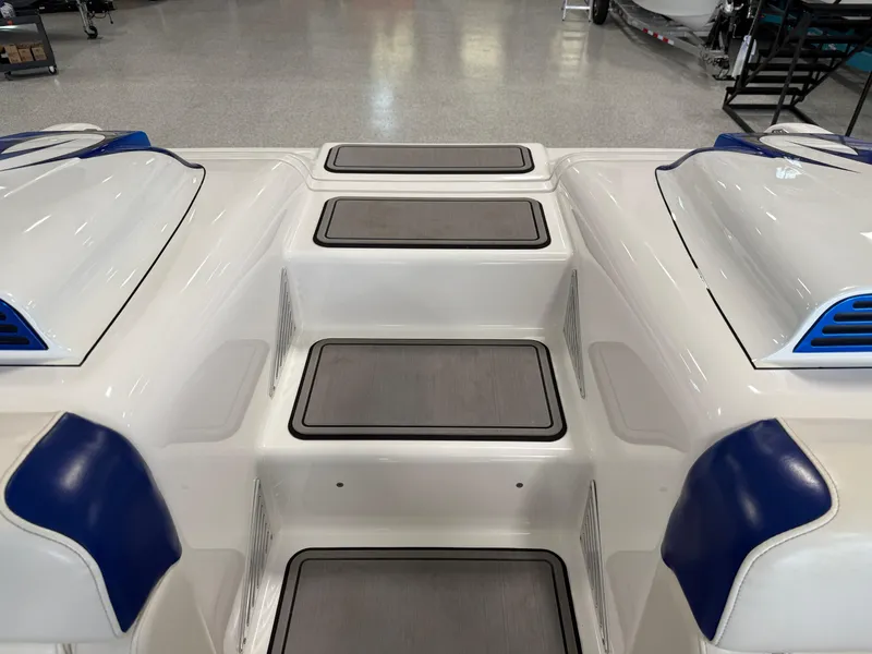 Slide: The Image of 2008 Magic 30' Sceptor boat interior with blue accents and non-slip steps. - 30