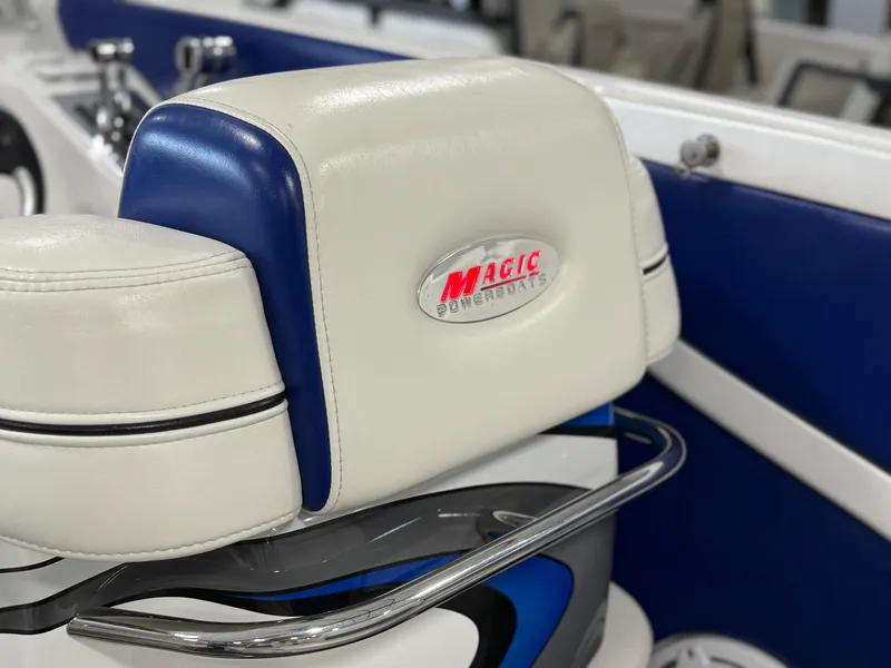 Slide: The Image of 2008 Magic 30' Sceptor boat seat with logo, featuring blue and white upholstery. - 46