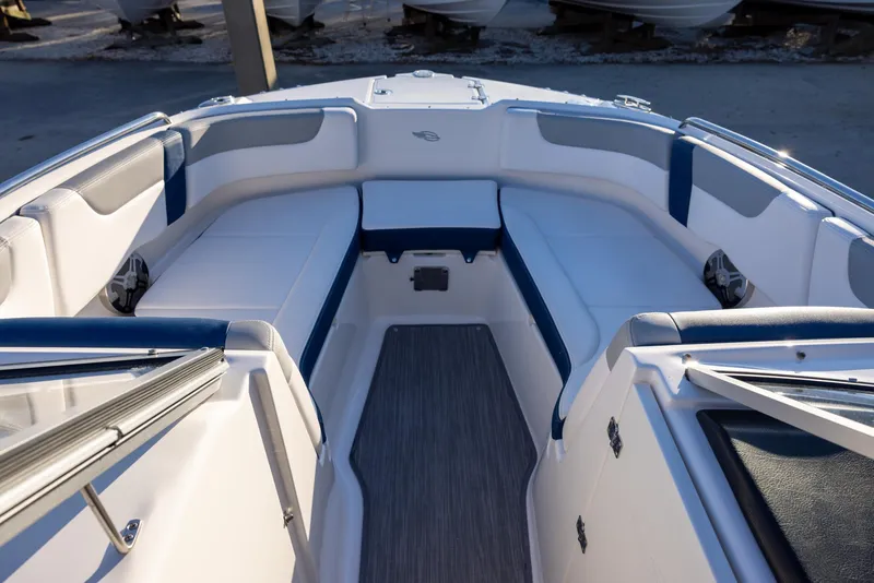 Slide: The Image of 2020 Chaparral 230 Suncoast boat interior with white and blue seating. - 12