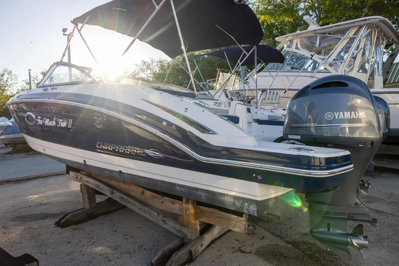 Slide: The Image of 2020 Chaparral 230 Suncoast boat with Yamaha engine, docked outdoors in sunlight. - 5