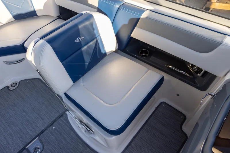 Slide: The Image of 2020 Chaparral 230 Suncoast boat interior with blue and gray seating. - 9
