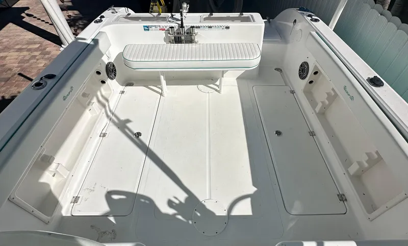 Slide: The Image of 2005 Sea Fox 257 Walk Around boat interior, featuring spacious deck and seating area. - 7