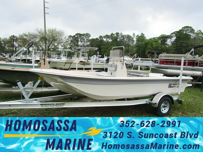 Slide: The Image of 2025 Carolina Skiff E Series E18 JVX CC boat on trailer at Homosassa Marine dealership. - 1