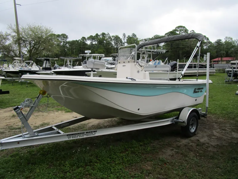 Slide: The Image of 2025 Carolina Skiff LS Series 17LS boat on trailer, displayed outdoors. - 2
