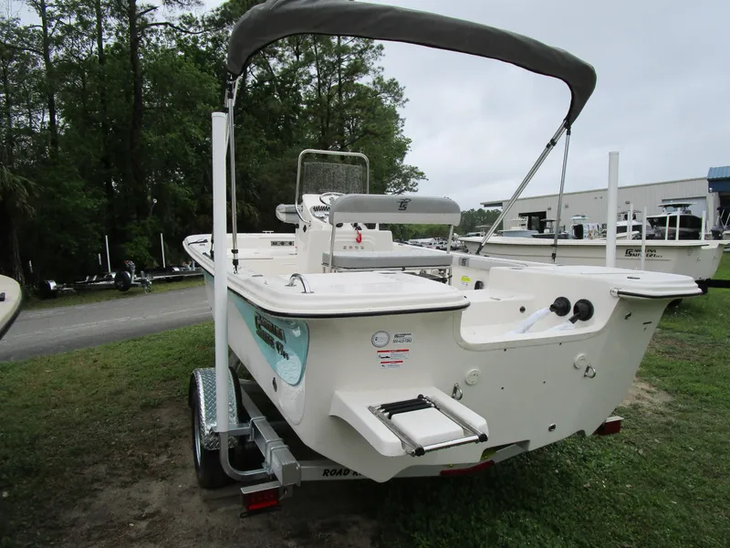 Slide: The Image of 2025 Carolina Skiff LS Series 17LS boat on trailer, parked outdoors. - 3