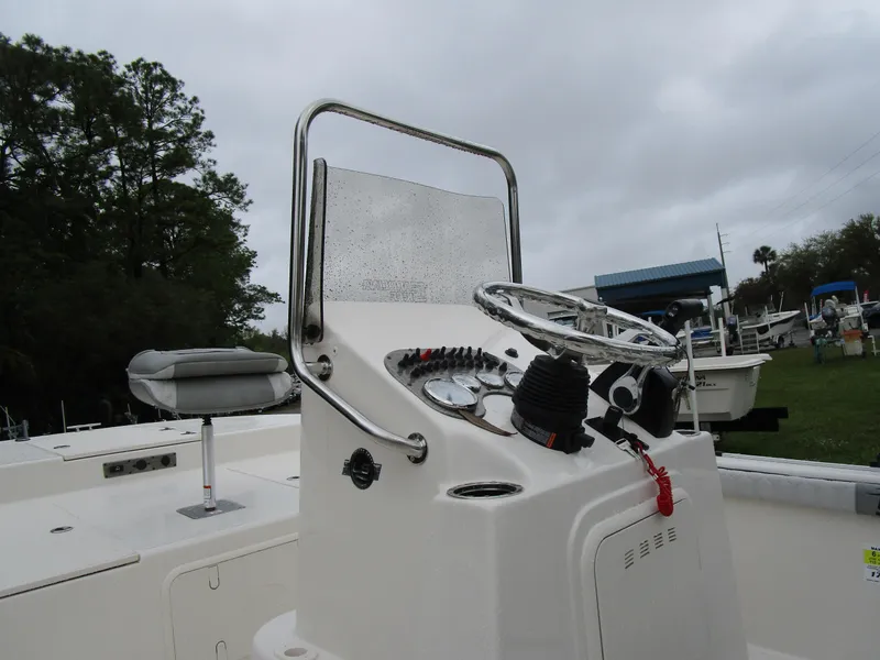 Slide: The Image of 2025 Carolina Skiff LS Series 17LS boat console with steering wheel and controls. - 6