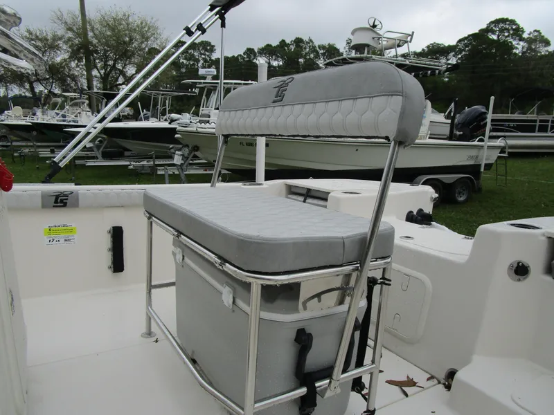 Slide: The Image of 2025 Carolina Skiff LS Series 17LS boat interior with cushioned seating and storage. - 7