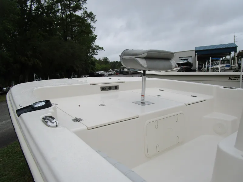 Slide: The Image of 2025 Carolina Skiff LS Series 17LS boat interior with seating and storage compartments. - 9