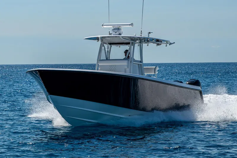 Slide: The Image of 2017 Contender 39 ST boat cruising on open water. - 15