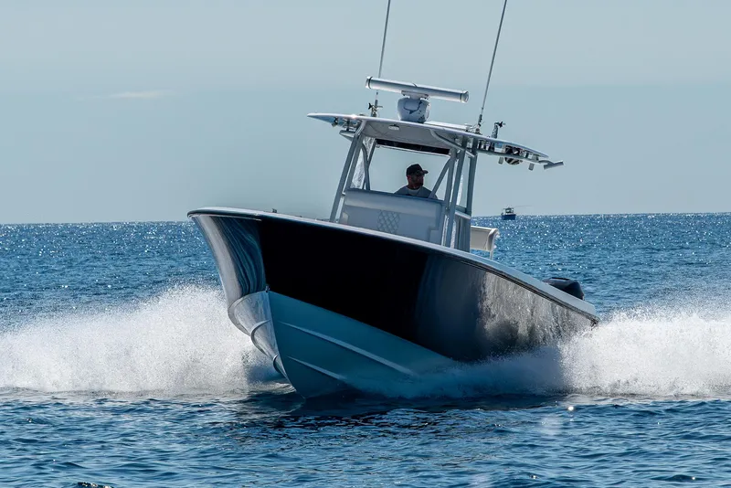 Slide: The Image of 2017 Contender 39 ST boat cruising on open water, creating a dynamic splash. - 28