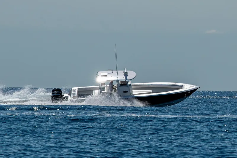 Slide: The Image of 2017 Contender 39 ST boat speeding on open water. - 37