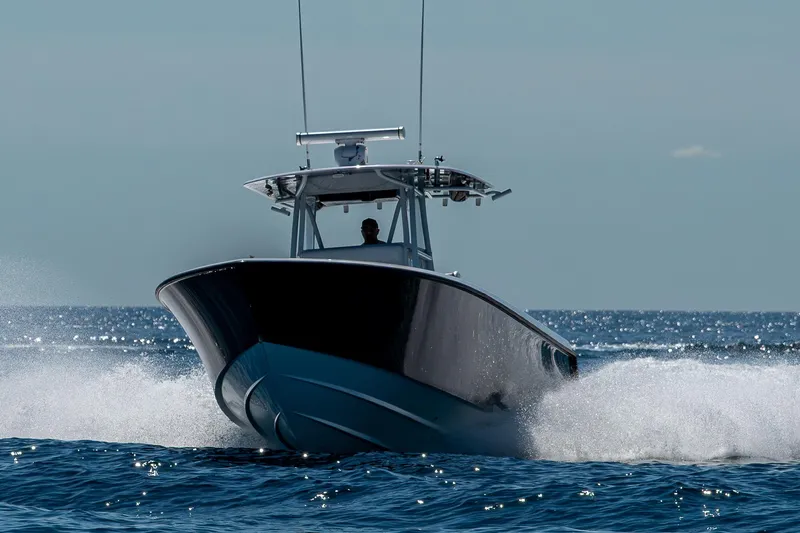 Slide: The Image of 2017 Contender 39 ST boat cruising swiftly on open water. - 38