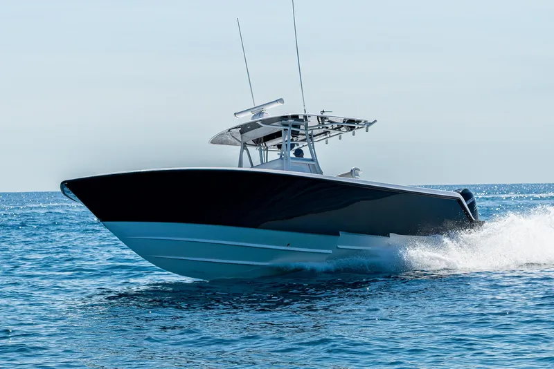 Slide: The Image of 2017 Contender 39 ST boat cruising on open water, showcasing sleek design and performance. - 40