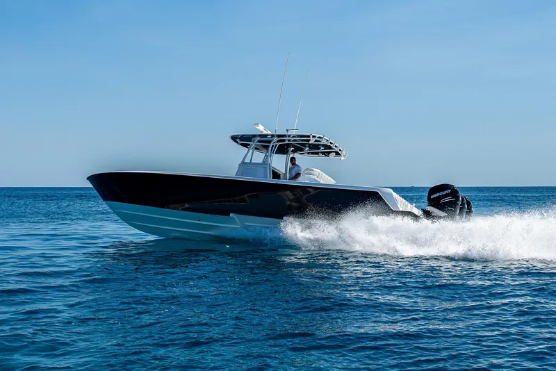 Slide: The Image of 2017 Contender 39 ST boat cruising on open blue water. - 41