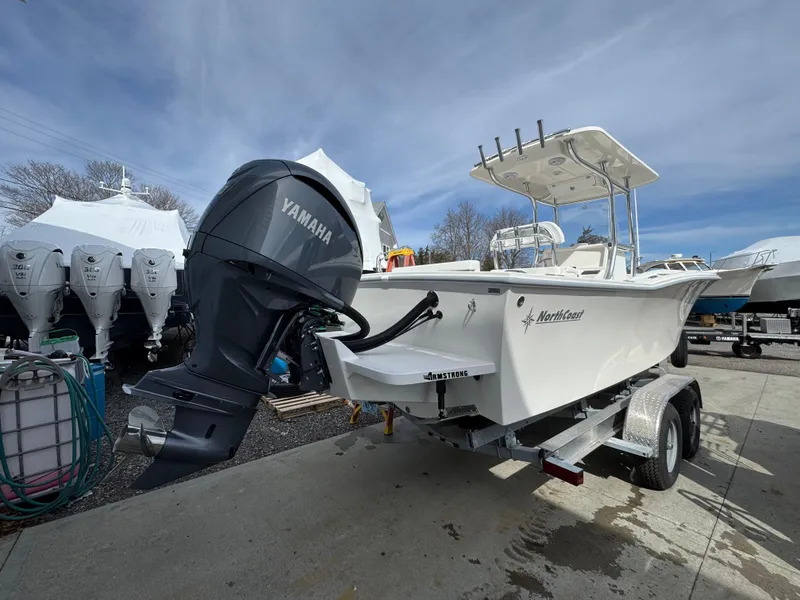 The Image of 2025 NorthCoast 230 Center Console boat with Yamaha engine on trailer. - 0
