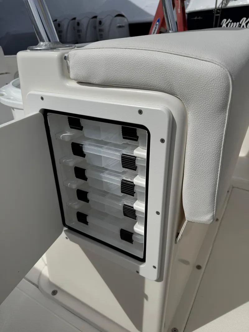 Slide: The Image of 2025 NorthCoast 230 Center Console boat with built-in tackle storage. - 15