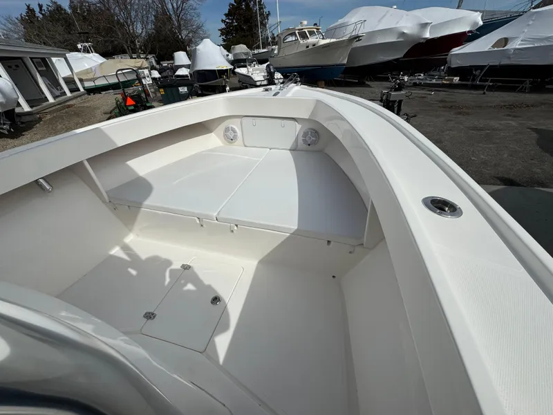 Slide: The Image of 2025 NorthCoast 230 Center Console boat interior, featuring spacious seating and storage. - 5