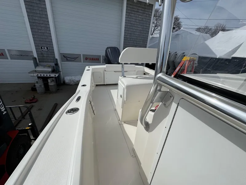 Slide: The Image of 2025 NorthCoast 230 Center Console boat interior, featuring sleek white design and modern amenities. - 6