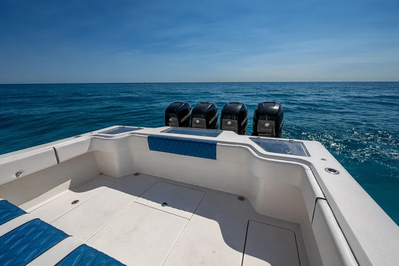 Slide: The Image of 2020 Front Runner 39 boat with four engines on open sea under clear blue sky. - 13